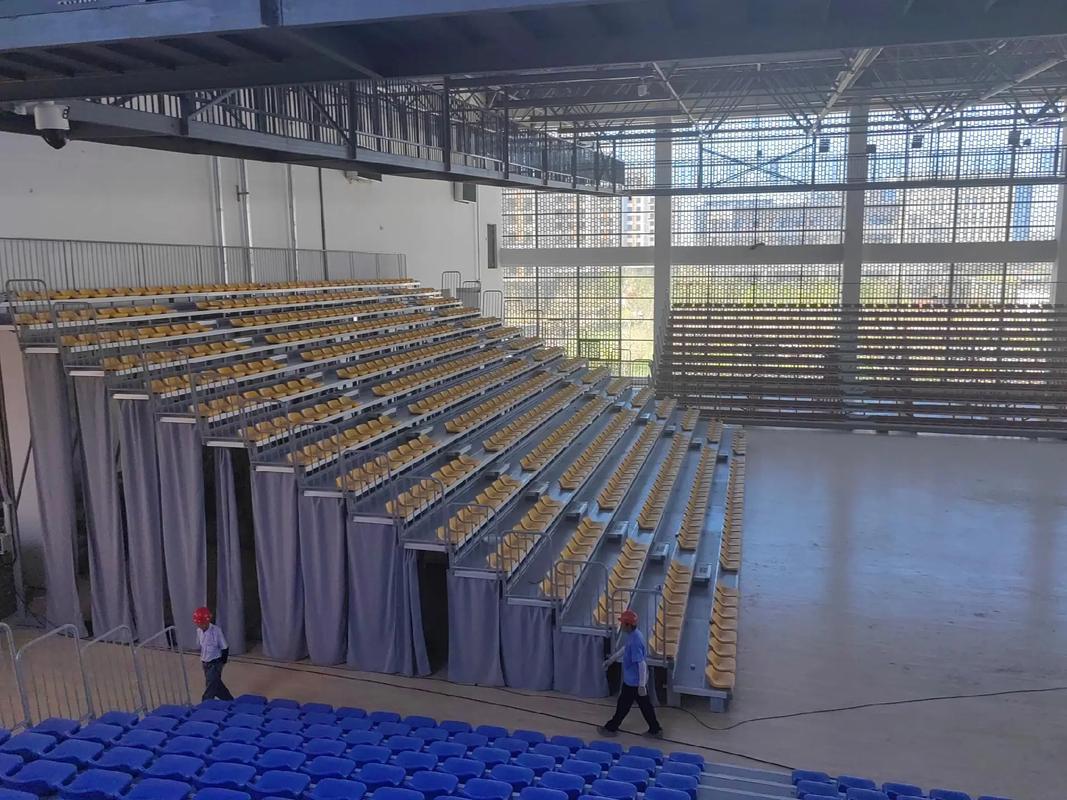 Mechanical skeleton of telescopic grandstand seats: full analysis of drive system, track material and safety guarantee